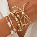 Gold Bead and Pearl Bow Bracelet Set stacked on wrist