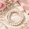Elegant Stackable Pearl Cross Bracelets lifestyle image